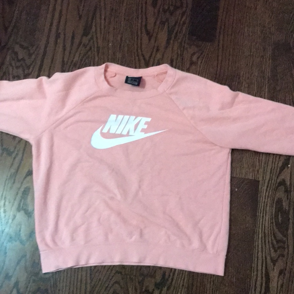This is a pink long sleeve Nike shirt